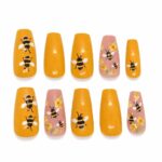bee-and-flower-press-on-nails-yellow-summer-nail-art-glamour-woman